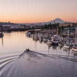 boat on the Duwamish River with Mt Rainier in the distance
