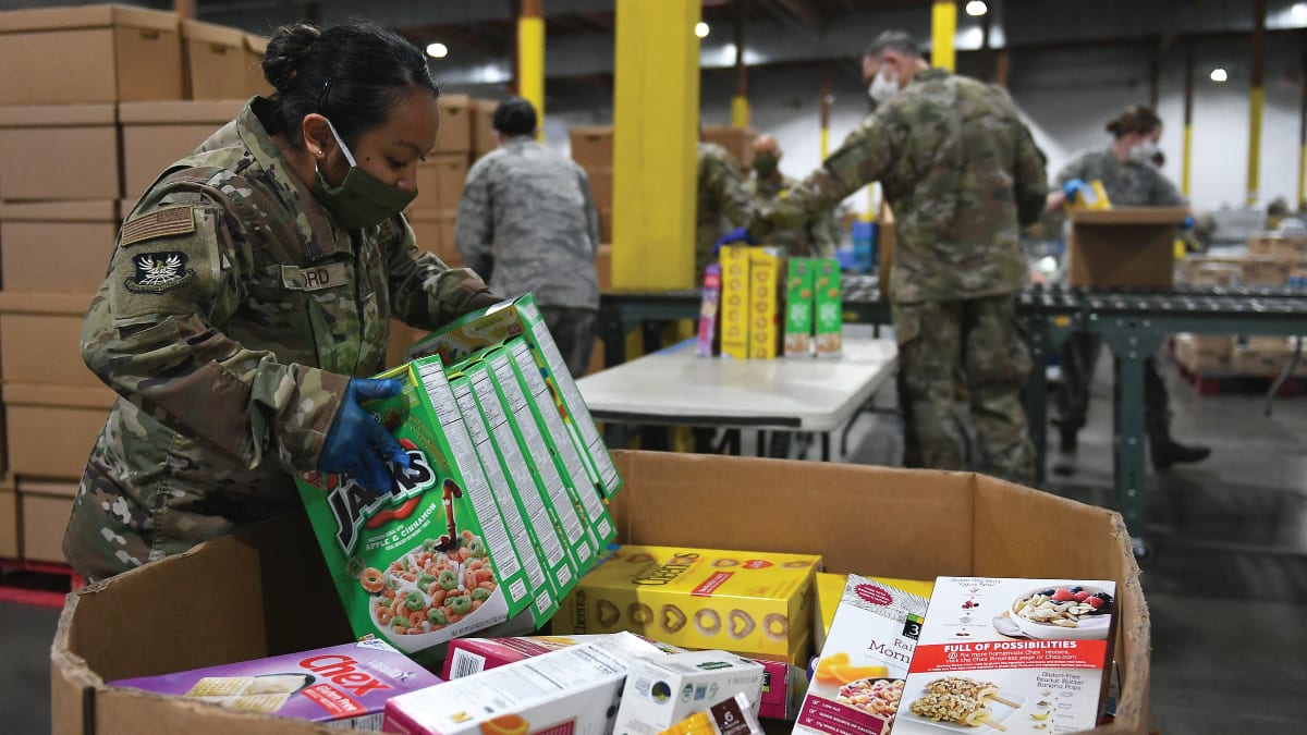 national guard office placing cereal boxes in large box