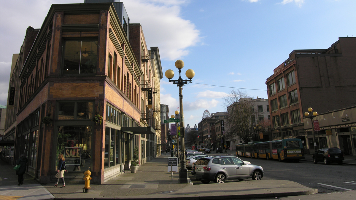 sidewalk with vintage street light and historic buildings