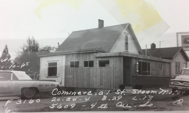 black and white photograph of the exterior of Barron Barbershop