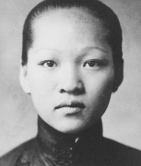 black and white photo of young Chinese woman staring intently at camera