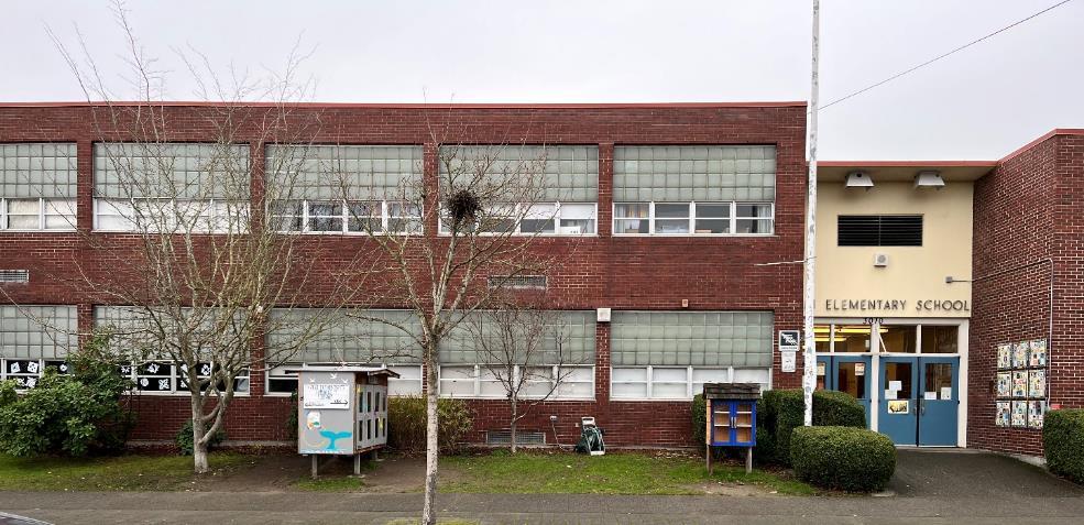 photograph of Alki Elementary school, a two-story brick building with large windows