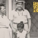 A black and white photo of a man, woman, and young girl. Logo in the corner reads "Seattle Histories"
