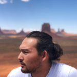 profile photo of a Diné/Filipino man in the desert