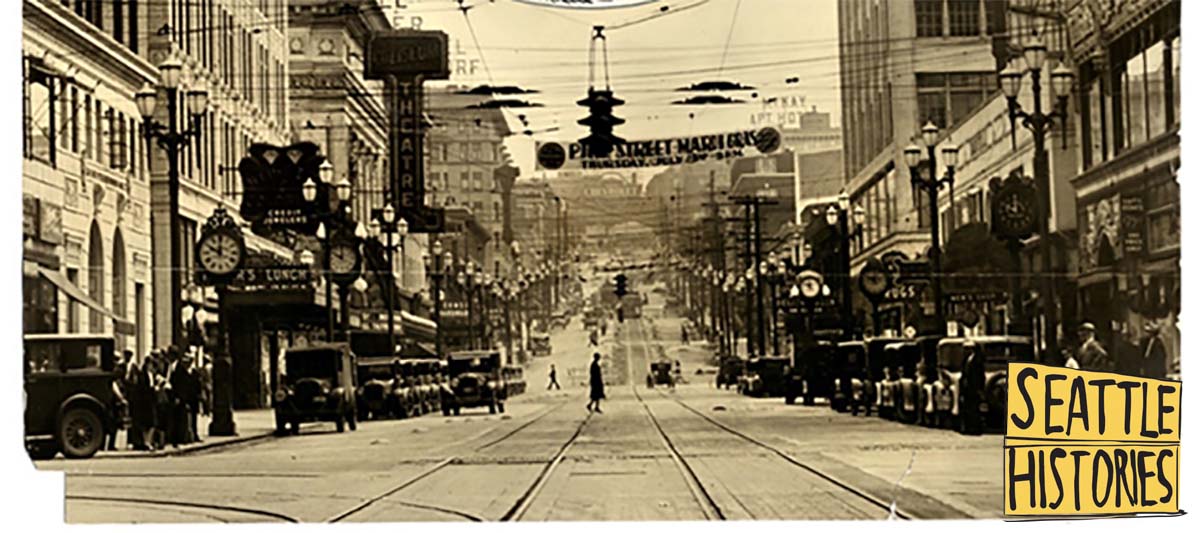 1930, looking east from 4th Avenue on Pike Street, several Joseph Mayer street clocks can be seen