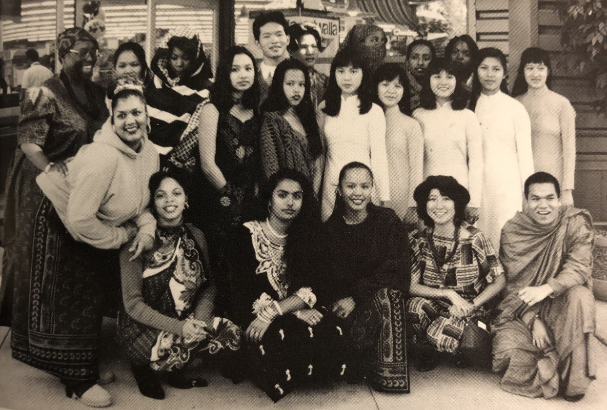 A black and white photo of a group of diverse teens from Middle College High School