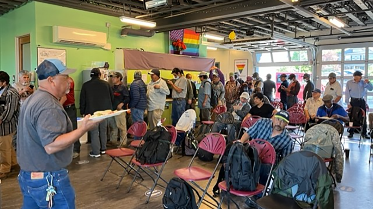 People line up to receive a hot lunch at the Casa Latina Day Worker Center