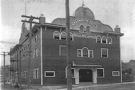 A ventage, black and white photo of a brick building with