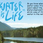Sweeping views of a watershed with mountains and bluesky. Text says "Water is Life"